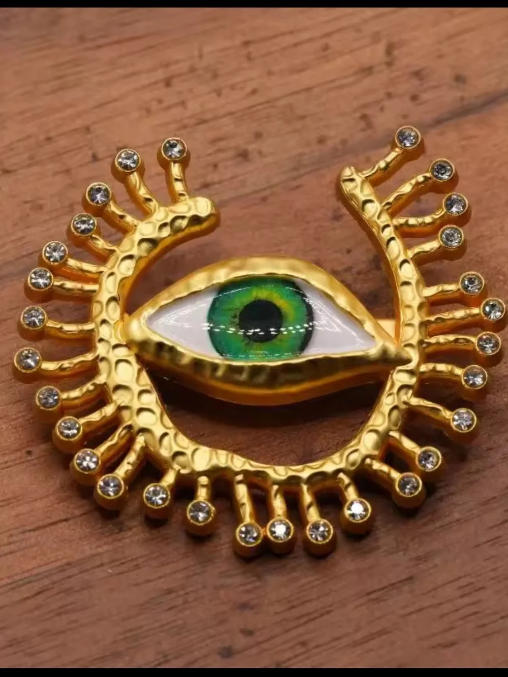 Gold-Tone Brooch with Blue Eye and Crystal Accents